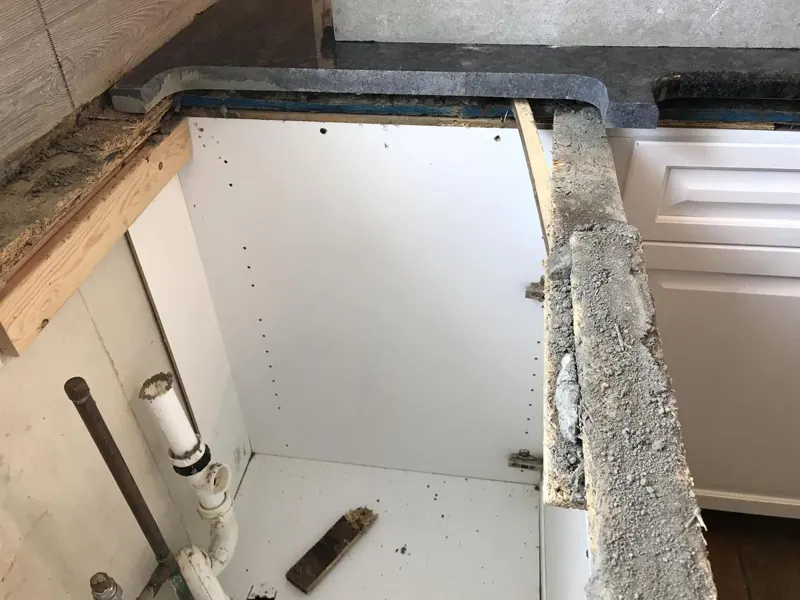 Old countertop removed and base cabinets exposed during a tear-out